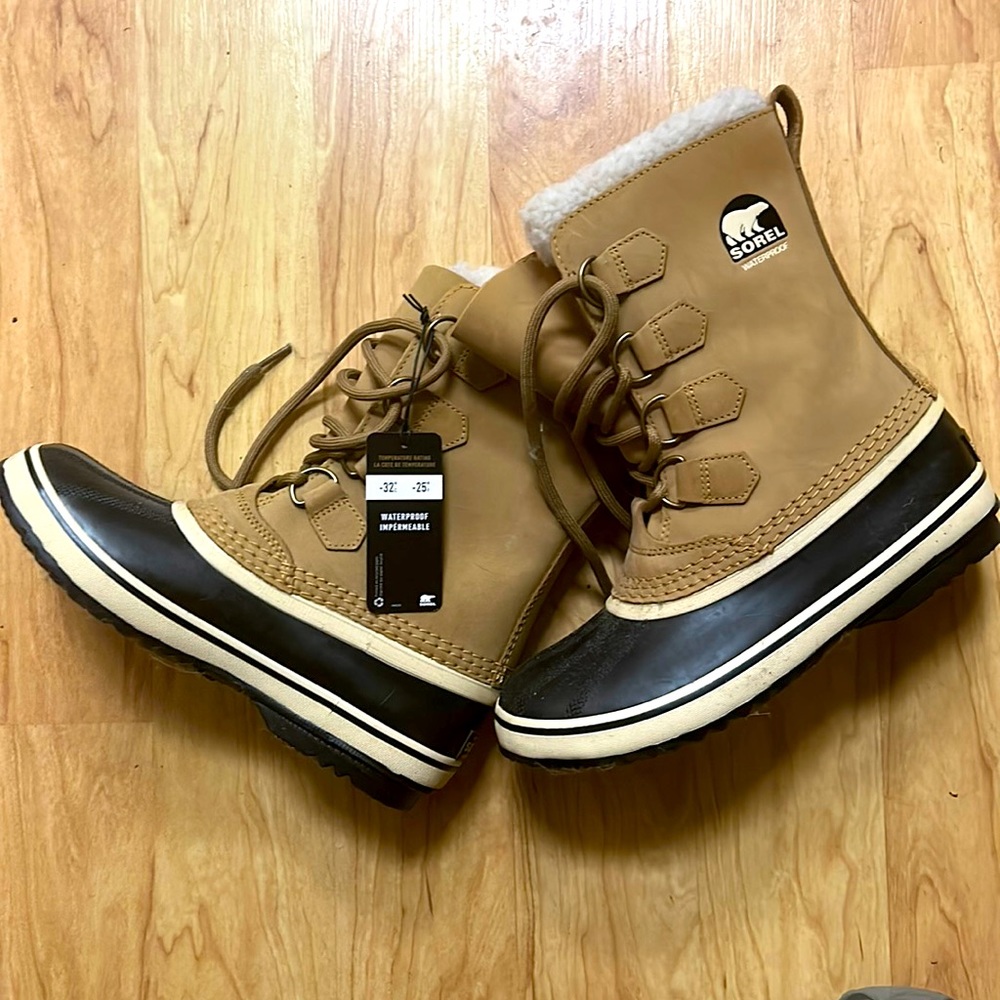Sorel classic leather, rubber boots. Never been worn, tags on.